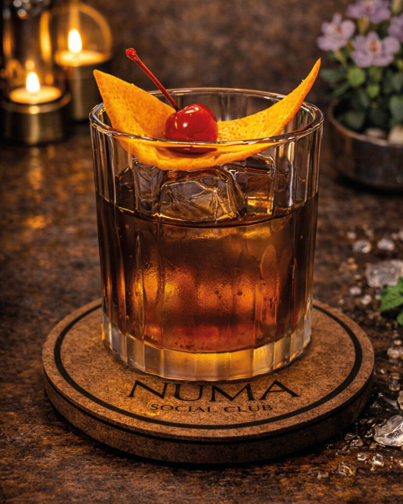 Old Fashioned cocktail at Numa Phuket, served with clear ice and orange garnish in a classic glass